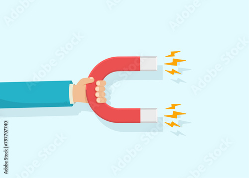 Hand holding an attracting magnet. Vector illustration.
