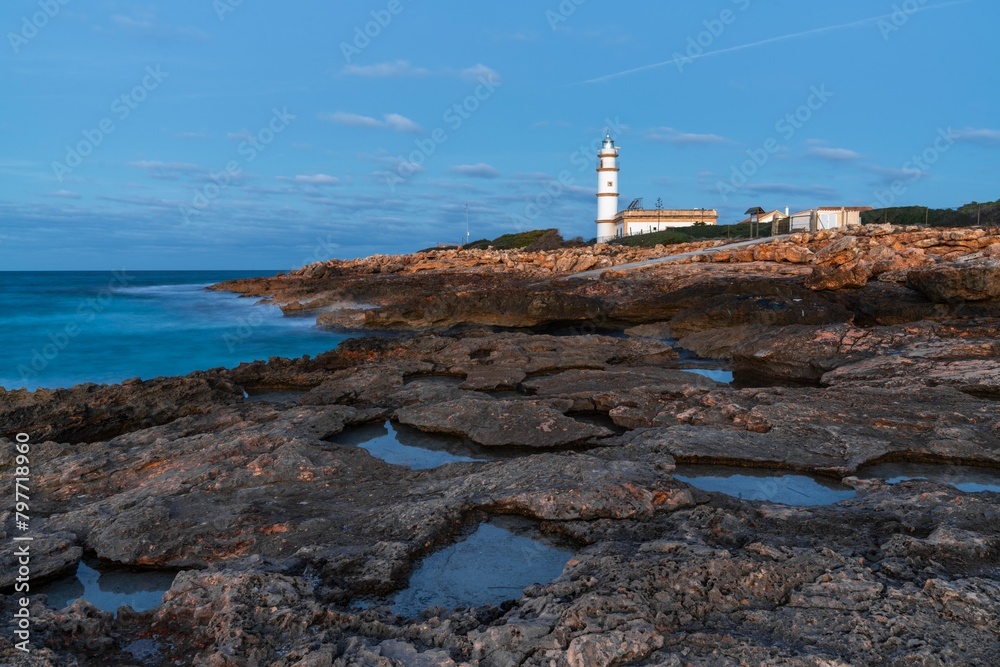Fototapeta premium long exposure view of the Cap de ses Salines Lighthouse on Mallorca just before sunrise