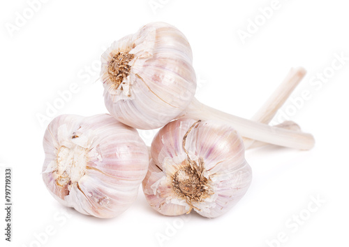 Three garlic bulbs isolated on a white background © Jacek Fulawka