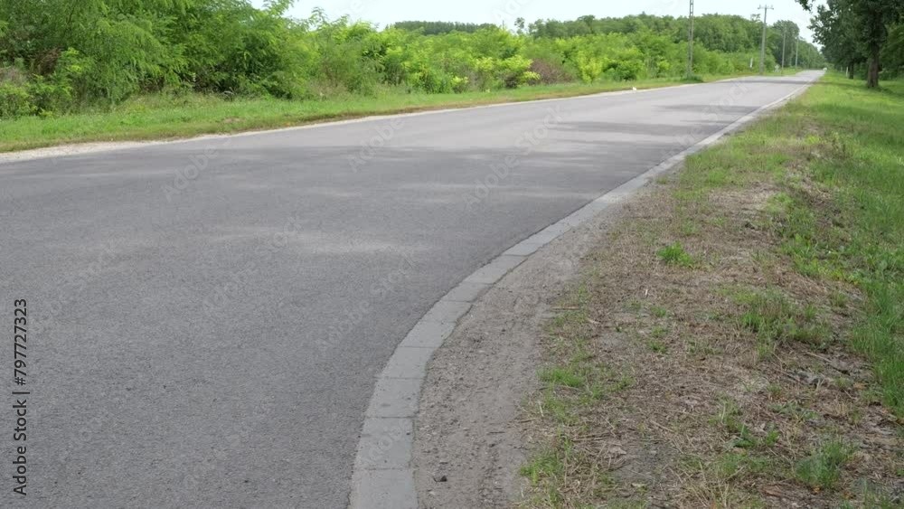Desolate Pavement Road In Rural Landscape. Close-up Shot Desolate Pavement Road In Rural Landscape. Close-up Shot