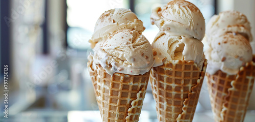 Waffle cones filled with scoops of artisanal handcrafted ice cream.