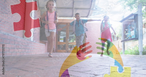 Image of puzzles falling over ribbon formed with puzzles and school children running in school