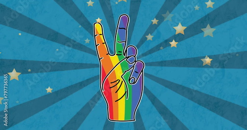 Image of rainbow color hand with victory gesture over stars and spiral pattern