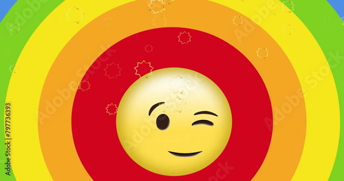 Image of wink emoji with speech bubble moving over rainbow color background