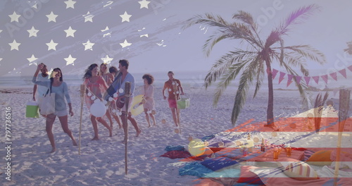 Image of american flag over happy diverse friends on vacation walking with bags on sunny beach