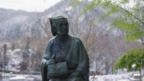 Statue of Matsuo Basho at Yamadera Temple in the Winter of Northern Japan photo