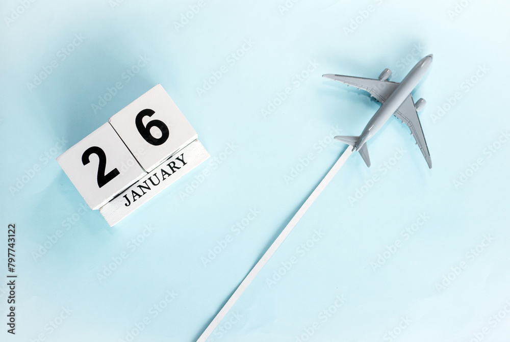 January calendar with number 26. Top view of a calendar with a flying passenger plane. Planner for the year by date of the day. Copy space. January calendar with number 26. Top view of a calendar with a flying passenger plane. Planner for the year by date of the day. Copy space.