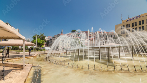 Fountain in Martim Moniz square timelapse hyperlapse in downtown Lisbon photo