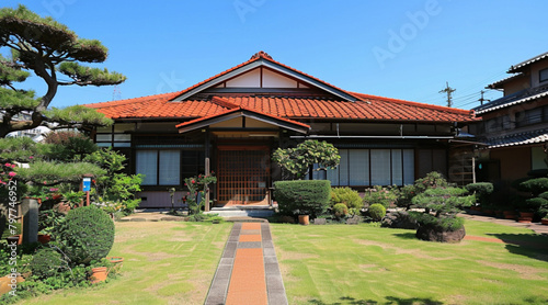 two houses that look exactly like each other, 1930s, japanese house, front yard very clean © Kholoud