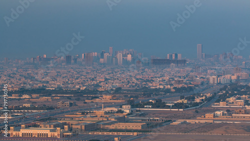 Cityscape of Ajman from rooftop early morning timelapse. United Arab Emirates.
