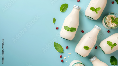 Bottles with probiotics and prebiotics dairy drink on light blue background. Bio yogurt with useful microorganisms. Production with biologically active additives. Fermentation and diet healthy food. photo