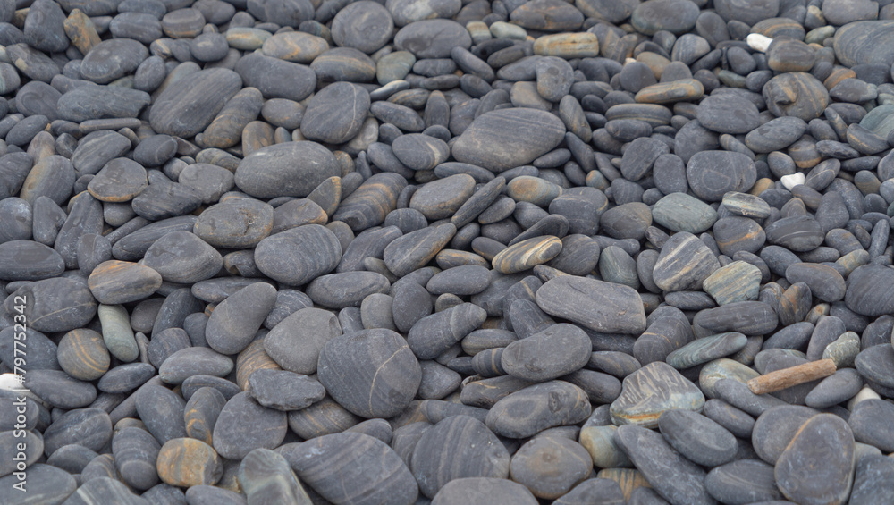 Granite gravel stone rocks flooring pattern surface texture. Close-up of exterior material for design decoration background. Rubble Granite gravel stone rocks flooring pattern surface texture. Close-up of exterior material for design decoration background. Rubble