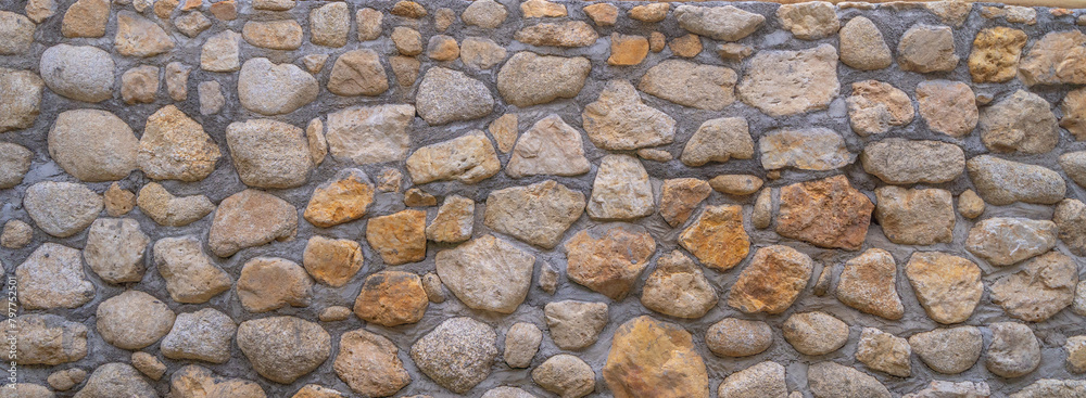 Granite gravel stone rocks flooring pattern surface texture. Close-up of exterior material for design decoration background. Rubble Granite gravel stone rocks flooring pattern surface texture. Close-up of exterior material for design decoration background. Rubble