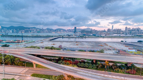 Canvas Print Hong Kong day to night, aerial view from kowloon bay downtown timelapse