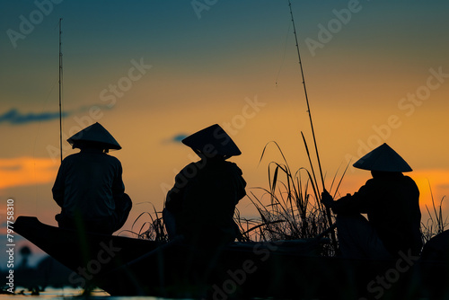 Three men in traditional conical hats fishing on a lake during sunset, AI-generated.
