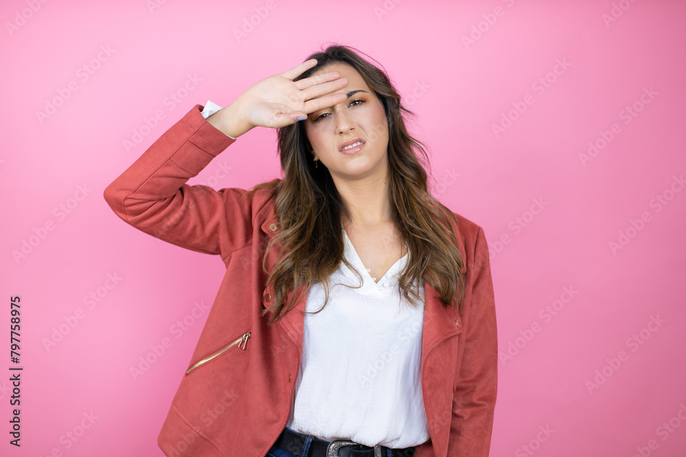 Young beautiful woman wearing casual jacket over isolated pink background Touching forehead for illness and fever, flu and cold, virus sick Young beautiful woman wearing casual jacket over isolated pink background Touching forehead for illness and fever, flu and cold, virus sick