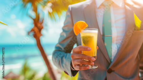 Business, vacation, summer concept. Businessman holding cocktail on the beach. The employee takes annual leave.  #797760772