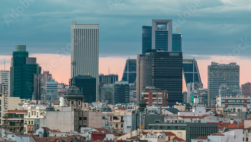Madrid Skyline at sunset timelapse with some emblematic buildings such as Kio Towers