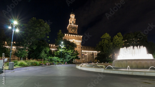 Main entrance to the Sforza Castle and tower - Castello Sforzesco night timelapse hyperlapse, Milan, Italy photo