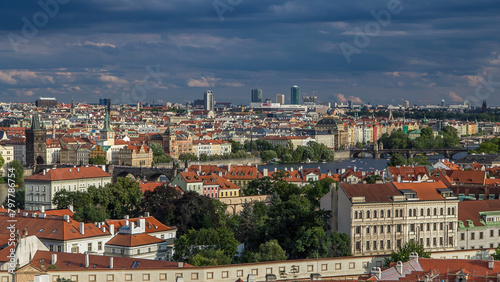 Panorama of Prague Old Town with red roofs timelapse, famous Charles bridge and Vltava river, Czech Republic. photo