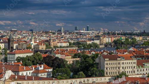 Panorama of Prague Old Town with red roofs timelapse, famous Charles bridge and Vltava river, Czech Republic. © neiezhmakov