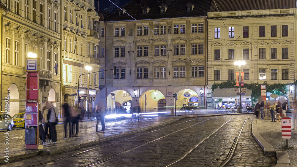 Fototapeta premium Night view of the illuminated malostranske namesti square timelapse in prague