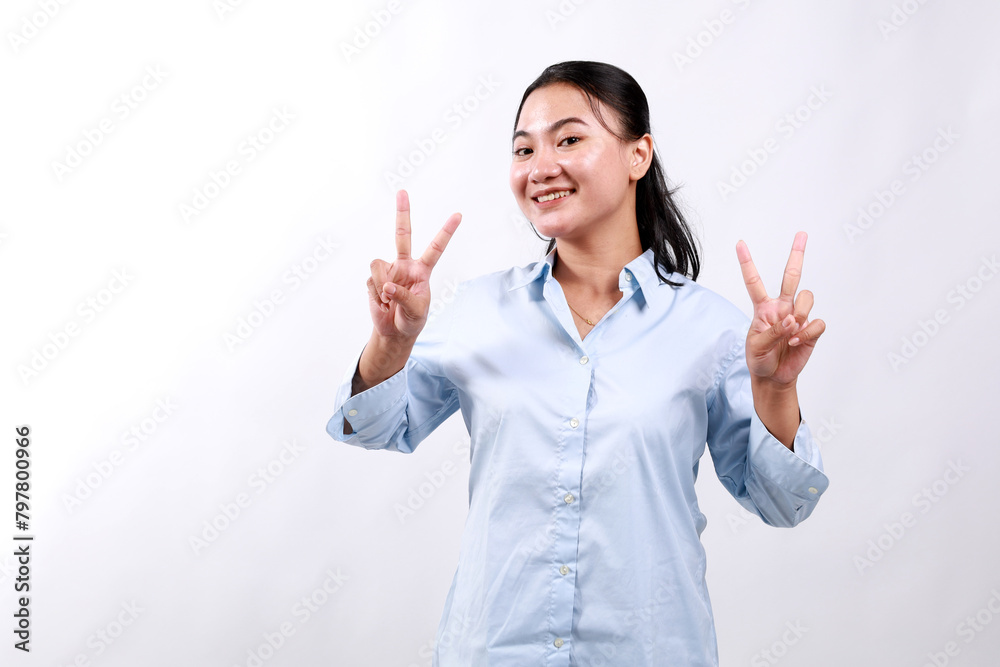 Positive charming asian woman showing victory peace signs look up happily smile enjoy celebration, white background