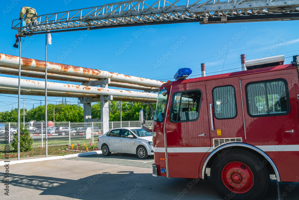 A fire truck for delivering firefighters to the fire site and supplying ...