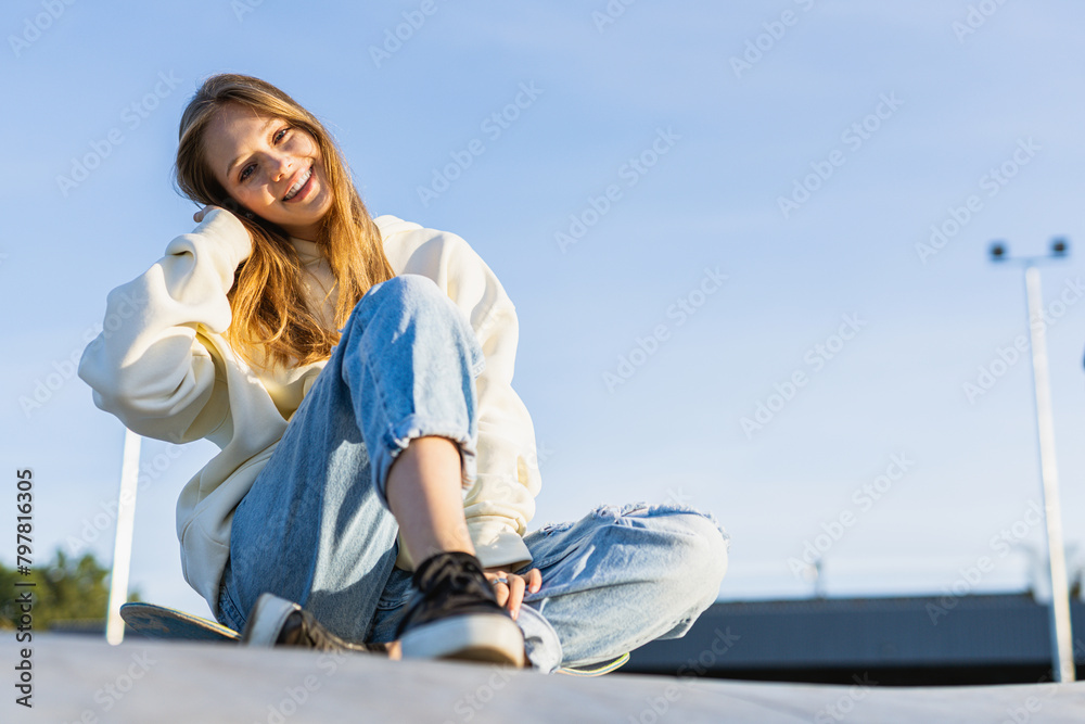 Young female skateboarder at skate park Young female skateboarder at skate park