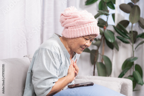 Stressed senior woman with breast cancer have trouble with chemotherapy healing, elderly retirement female pain and difficulty breathing according to chemotherapy or heart attacks stay at home alone