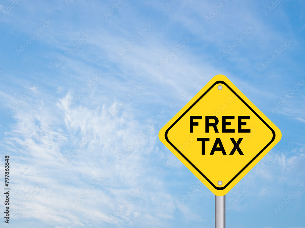 Yellow transportation sign with word free tax on blue color sky background Yellow transportation sign with word free tax on blue color sky background