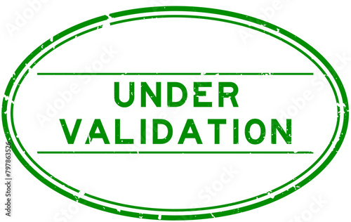 Grunge green under validation word oval rubber seal stamp on white background