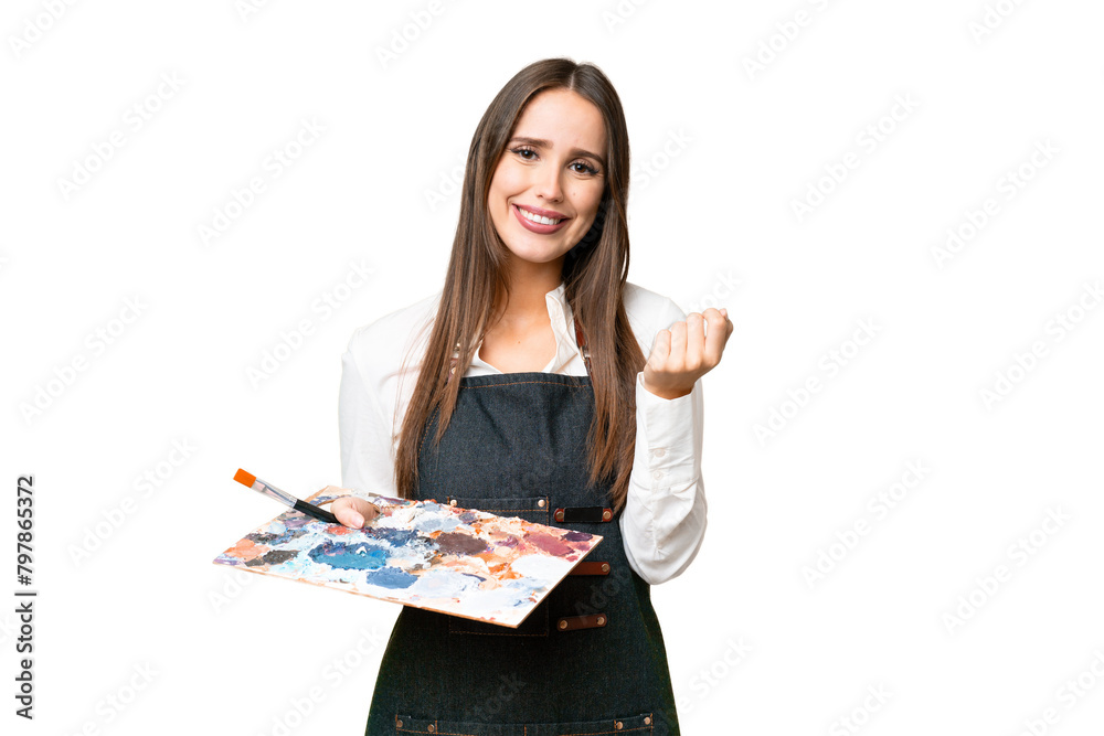 Young artist woman holding a palette over isolated chroma key background making money gesture Young artist woman holding a palette over isolated chroma key background making money gesture
