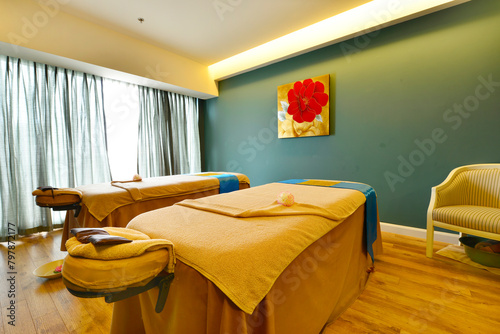 Photography Interior of Spa room consisting of bench pillows towels and low level lighting