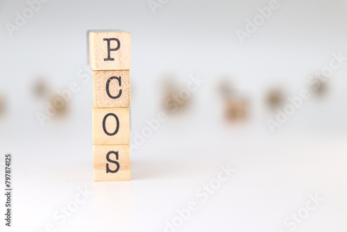 PCOS abbreviation. Concept of polycystic ovary syndrome isolated on white background photo