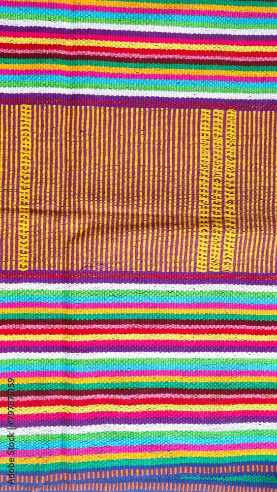 Handmade woven textile from Indonesia, textured ethnic fabric background Handmade woven textile from Indonesia, textured ethnic fabric background
