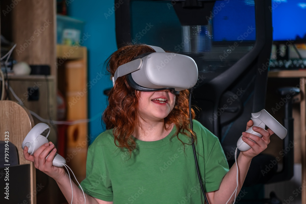 redhead teen girl at home in living room put on vr helmet to enjoy virtual reality online game cyber space world simulation. cute girl has fun using new electronic device for entertainment redhead teen girl at home in living room put on vr helmet to enjoy virtual reality online game cyber space world simulation. cute girl has fun using new electronic device for entertainment
