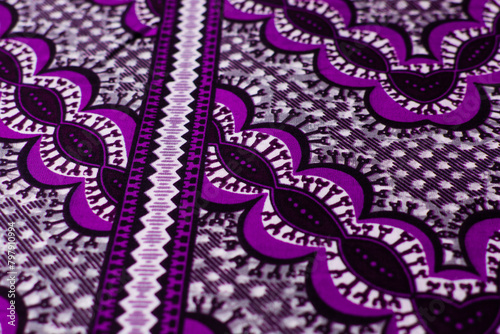 top view of purple ankara fabric, flatlay of nigerian wax cloth with designs, spread out purple ankara material