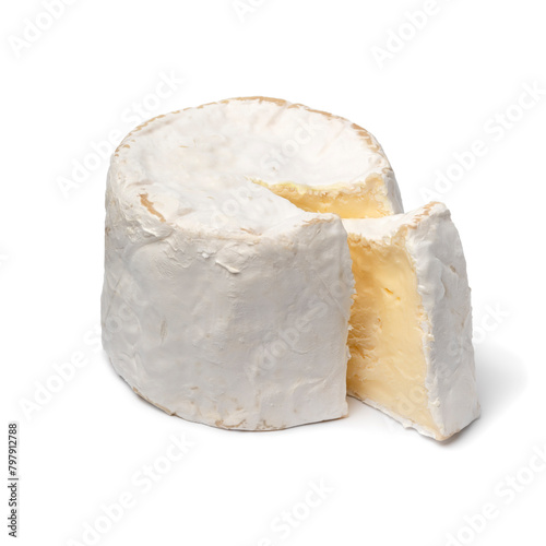 Single French Chaource cheese and a piece isolated on white background close up photo
