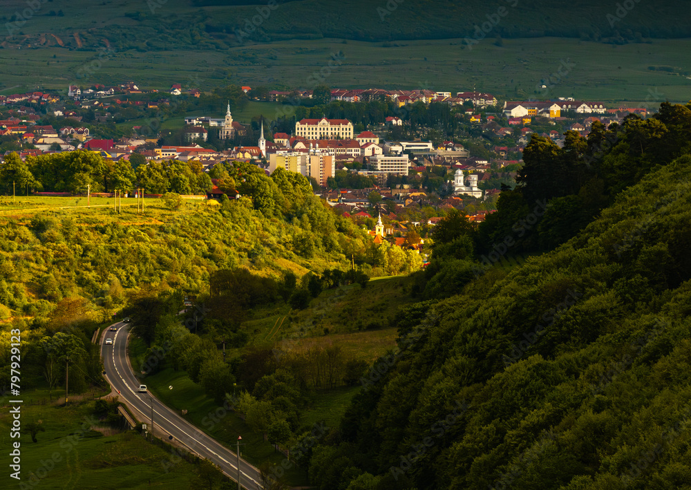 Fototapeta premium Odorheiu Secuiesc from above. Aerial view of this beautiful city from Transylvania, Harghita county, during a summer sunny day. Travel to Romania.