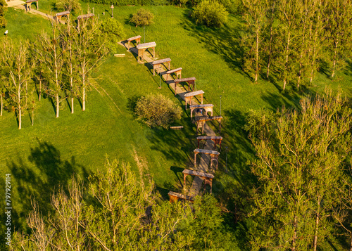 Museum of the Szekler gates (Muzeul Portilor Secuiesti in Romanian language) in Odorheiu Secuiesc city from Harghita county in Romania. Aerial view of this landmark museum during a sunny day. photo