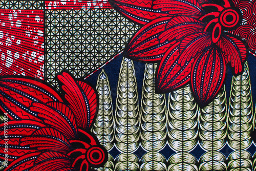 top view of red yellow ankara fabric, flatlay of nigerian wax cloth with designs, spread out red yellow ankara material