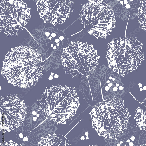 Delicate seamless pattern with white silhouettes of skeletonized aspen leaves on a gray background. For fabric, textile, wrapping paper, cover, wallpaper.