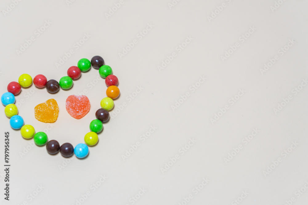 Heart shaped Candy and multi colored candy on Isolated on White Background. Heart shaped Candy and multi colored candy on Isolated on White Background.