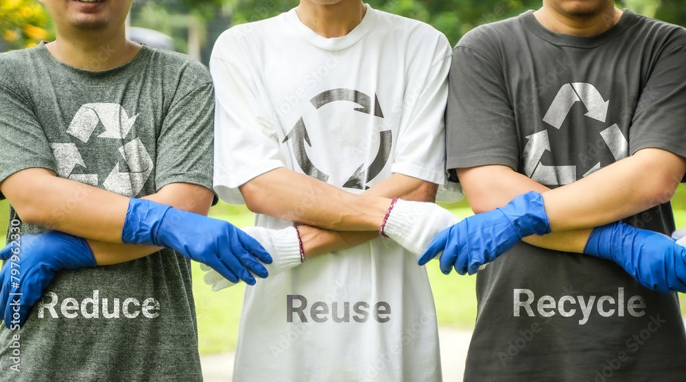Hands holding hands to reduce, reuse, recycle symbols on green bokeh ...
