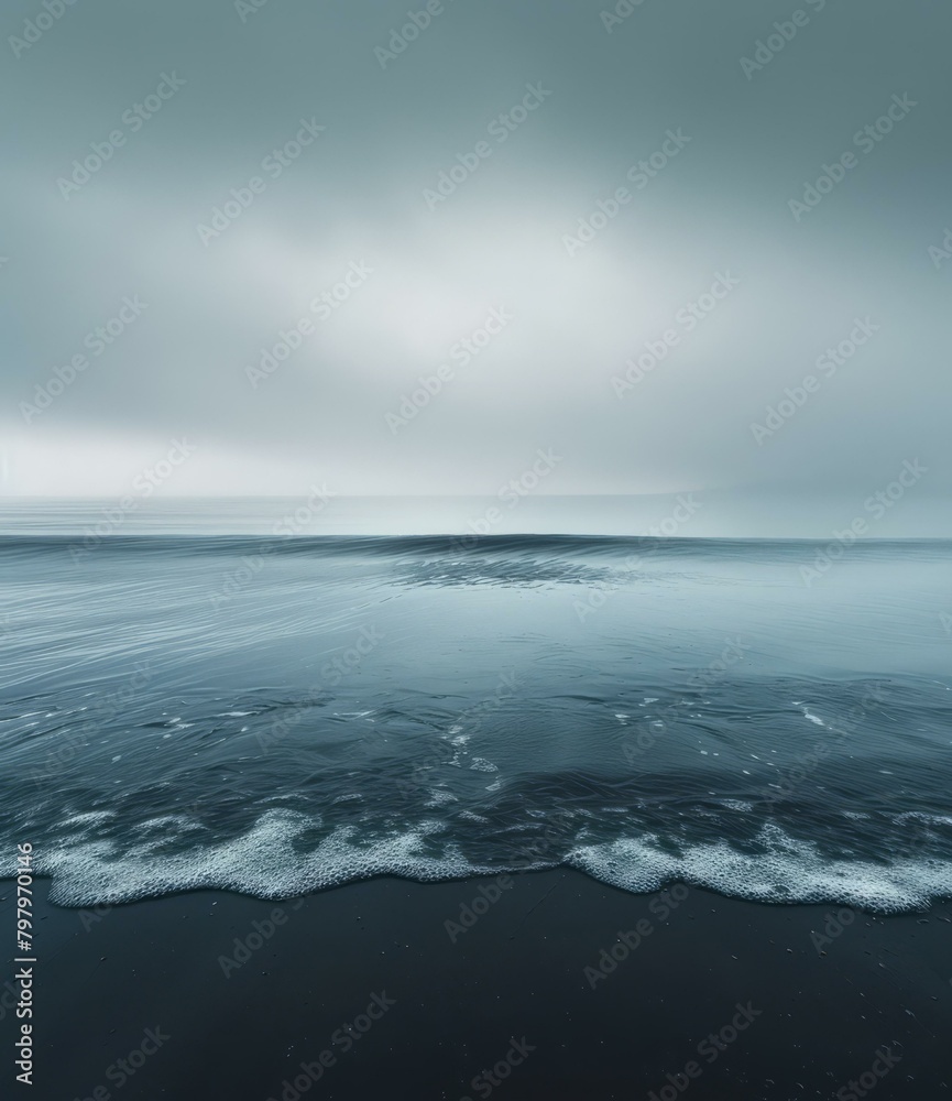 b'Dark and moody seascape with a wave crashing on the shore'