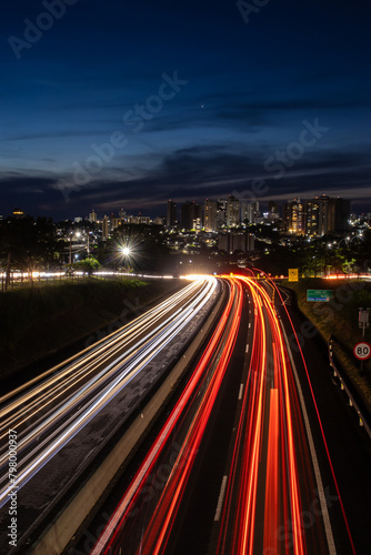 Trail of light caused by vehicular traffic in SP-294, Comandante Joao Ribeiro Barros Highway with buildings from downtown in the background, in Marília, © AlfRibeiro