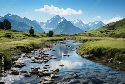 b'mountain river landscape with green grass and blue sky'