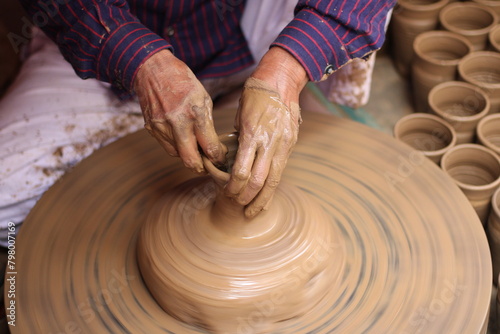 Photography A skilled potter crafting a bowl in a pottery workshop or studio