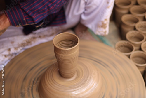 Photography A skilled potter crafting a bowl in a pottery workshop or studio